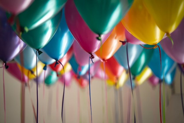 birthday balloons hanging from the ceiling