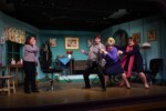 The Steel Magnolias cast practicing the "Hit her!" scene, breaking the tension of the moment with laughter.